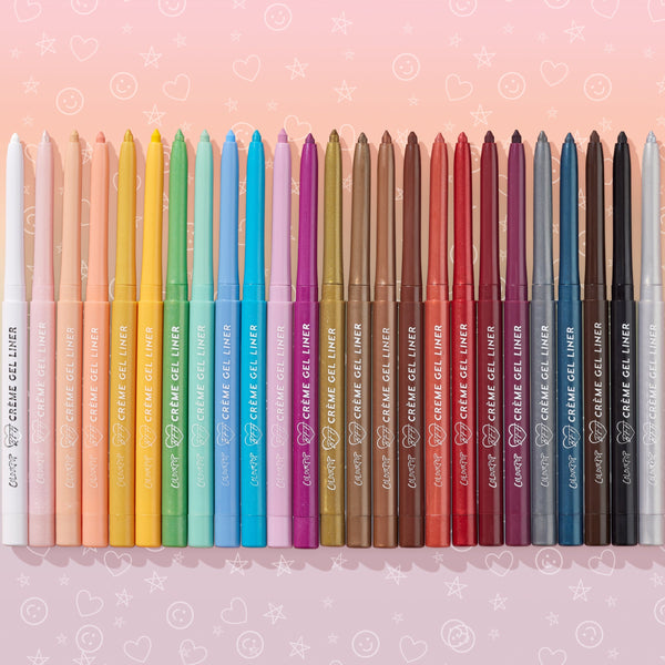 Total Essentials ColourPop Crème Gel Liner pencils stand in a rainbow row, tips up to show pastels, brights, nudes, and metallics on a pink gradient with doodled stars and hearts; retractable crème gel eyeliner set.