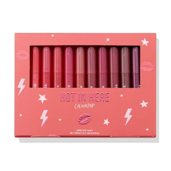 Heat Warning ColourPop Lippie Vault Set showcasing 10 Lippie Stix in gradient shades from bright coral and pink to berry and plum, arranged upright behind a clear window in a coral box labeled 'Hot In Here' with star and lightning graphics.