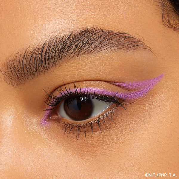 Violet winged liner defining the upper lash line with an extended flick and inner-corner accent on a close-up eye, showcasing ColourPop Crème Gel Liner Azabu-Juban, a creamy, smudge-resistant crème gel eyeliner for bold precision.