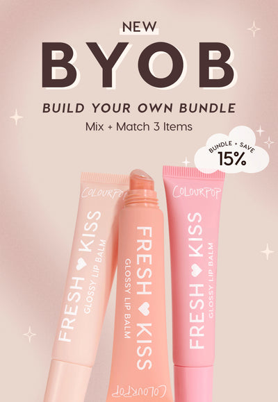 Colourpop Fresh Kiss Glossy Lip Balm tubes in peach and pink stand in a trio, promoting BYOB Build Your Own Bundle; mix and match three items and save 15%, set against a soft blush background with star accents.