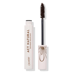 ColourPop Act Natural Mascara in Brown, open tube showing spoolie wand coated in brown formula beside a pale pink tube with brown βAct Natural Defining Mascaraβ text and droplet motif, product standing upright on a white background.