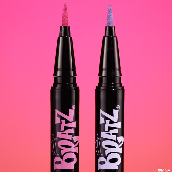 Two Bratz x ColourPop felt-tip eyeliners stand uncapped, revealing hot pink and lavender tips against a vibrant pink gradient background, showcasing the Bratz logo - part of the Bratz x ColourPop Full Collection, a ColourPop Full Collection Set.