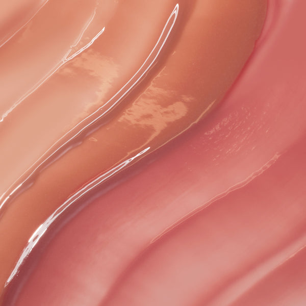 Multi-shade lip oil swatches in peach and rose hues gliding in glossy waves, showcasing the high-shine, sheer finish of Juicy Moment, a ColourPop So Juicy Lip Oil Set.