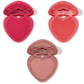 Three heart-shaped powder blush compacts from Totally Lovestruck, opened to reveal hot pink, vibrant coral, and soft nude rose shades with lip-shaped mirrors on a white background - ColourPop Heart Powder Blush Set for fresh, buildable color.