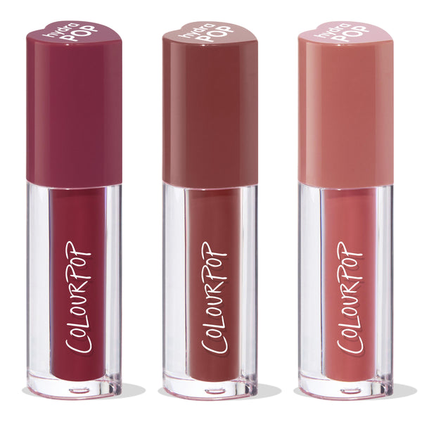 Trio of ColourPop Lip Stain, Everyday Besties, standing upright - clear tubes with ColourPop logo and heart-shaped caps in deep berry, warm mocha, and soft rosy nude shades, grouped as a bundle on a white background.