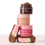 Neapolitan Sundae ColourPop Lip Scrub trio - Strawberry Milk, Vanilla Cake, and Chocolate Milkshake - stacked with the top jar open to show scrub texture, flanked by Neapolitan ice cream sandwiches on a white background.