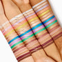 ColourPop Socialite Shadow Stix swatched as a bold metallic teal eyeshadow stripe on three different skin tones, shown among other colorful Shadow Stix shades to highlight pigment payoff and smooth, creamy texture.