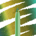 Wild Idea ColourPop Chrome Crème Gel Liner displays a multichrome tip shifting teal, green, and gold, drawing creamy strokes across a swatched backdrop; mint twist-up pencil in macro close-up for bold, long-wear eye looks.