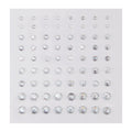 Clear round rhinestone stickers in graduated sizes sparkle on a white backing sheet, arranged in neat rows; ColourPop Crystal Face Jewels, Individual pack, self-adhesive crystals for customizable face and eye makeup looks.