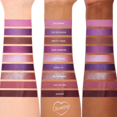 ColourPop Shadow Palette It's My Pleasure swatched on three arms with light, medium, and deep skin tones, showing nine purple hues - lilac, mauve, plum, and berry - in matte and shimmer, with shade names like Kittenfish and Sleeper visible.