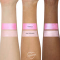 ColourPop Liked Christmas a Lot… Shadow Stix Set swatches, showing Whoville (vivid shimmery pink) and Who Stockings (pale pink shimmer) applied in wide bands on three forearms across light, medium, and deep skin tones.