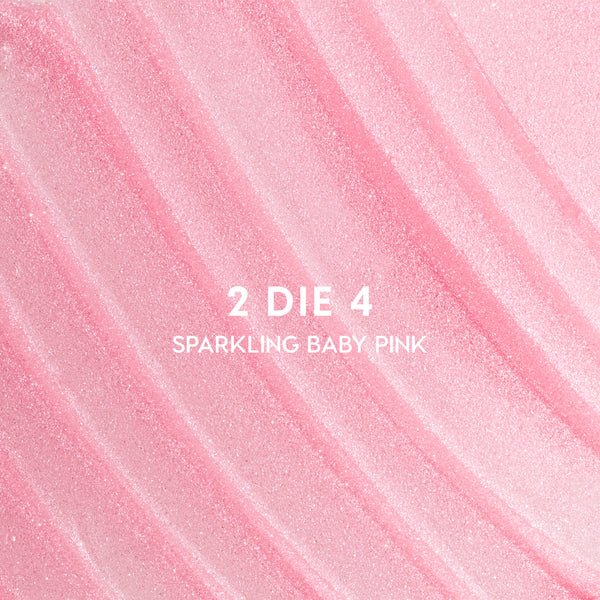Shimmery baby pink swatch labeled “2 DIE 4 Sparkling Baby Pink,” showing the luminous blush shade from the Heart to Get 2 Good 4 U Blush + UGL set in a close-up textured background.