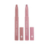 Two ColourPop Love At First Swipe Shadow Stix in the Heart to Get duo stand uncapped on a white background, showing matte mauve and shimmery pink cream eyeshadow sticks with matching pink tubes and star logo for easy swipe-on eye makeup.