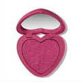 Heart to Get Cuter than Cupid Super Shock Blush compact showing a shimmery hot pink heart-shaped blush pan inside a matching heart case with mirror, styled on a clean white background for US makeup lovers