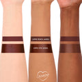Cloe Lippie Kit by ColourPop swatched - two rich plum-brown stripes (Lippie Pencil and Lippie Stix labeled “Angel”) on three arms of different skin tones, showing matte pencil and creamy stix finishes with a ColourPop heart logo at the bottom.