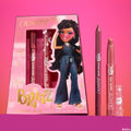 Sasha ColourPop Lippie Kit displaying a mauve lip pencil and rosy nude Lippie Stix beside a pink Bratz-themed box with Sasha artwork and gold logo, set against a pink gradient background.