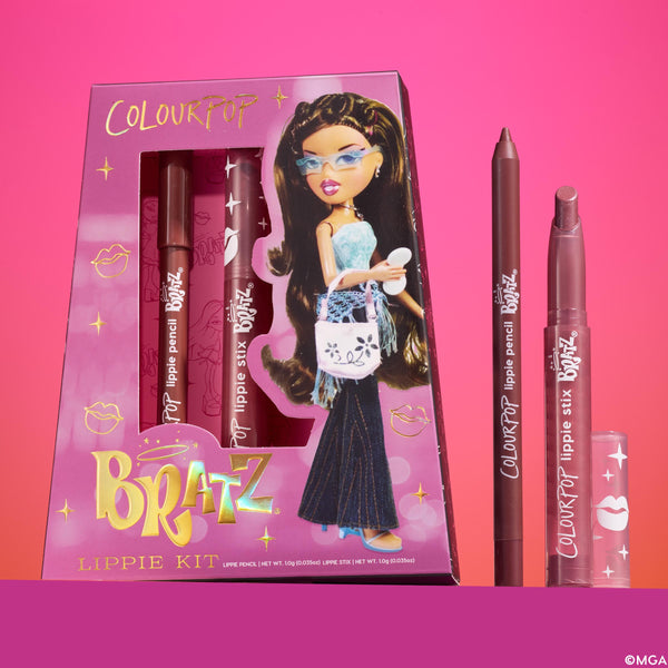 Yasmin ColourPop Lippie Kit, a Bratz collab, displays the boxed set with Bratz artwork next to an uncapped lippie pencil and Lippie Stix in rosy-brown shades, standing upright against a pink gradient background for a nostalgic lip duo gift.