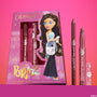 Yasmin ColourPop Lippie Kit, a Bratz collab, displays the boxed set with Bratz artwork next to an uncapped lippie pencil and Lippie Stix in rosy-brown shades, standing upright against a pink gradient background for a nostalgic lip duo gift.