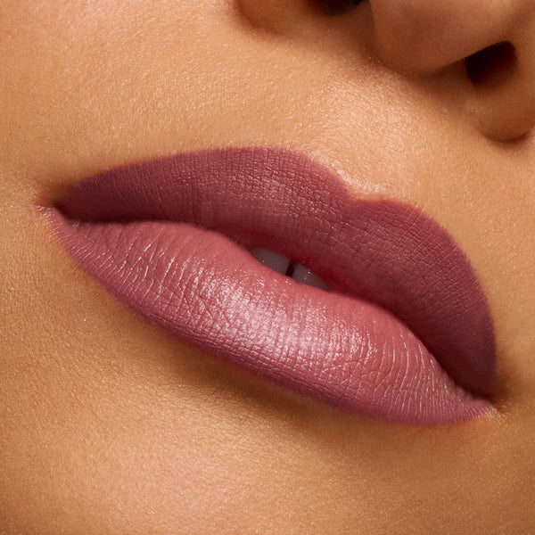 Mauve-rose lips wearing Secret Kiss, lined and filled for a soft-matte finish, showcasing precise definition from the ColourPop Lipstick & Lip Pencil Set in a macro close-up against smooth skin.