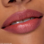 Lips lined and filled with ColourPop Lippie Pencil Pinky Promise, creating a soft rosy-pink, satin finish; extreme close-up beauty swatch on warm-toned skin highlighting smooth texture and precise lip contour.