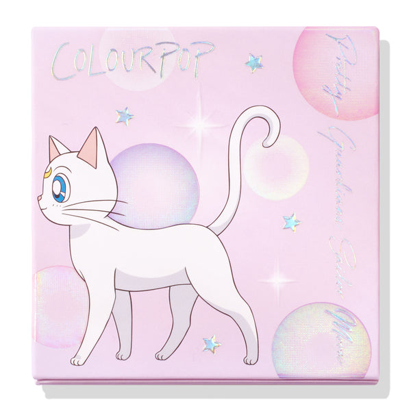 Moonlight Pressed Powder Highlighter compact shown closed, featuring ColourPop x Pretty Guardian Sailor Moon artwork with Artemis the white cat, holographic stars, and pastel pink iridescent bubbles; ColourPop Pressed Powder Highlighter.