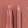 Double the Trouble ColourPop Lippie Stix + Pencil Set shown side by side in a warm rosy nude; the twist-up Lippie Stix and matching precision pencil rest on a glossy pink swatched backdrop, highlighting the coordinated shade for lining and filling lips.