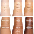 ColourPop Pretty Fresh Tinted Foundation Balm in Fair 4 swatched on a forearm beneath Fair 1 and Fair 3, shown with adjacent arms displaying labeled shades from Light to Deep Dark for side-by-side tone comparison.