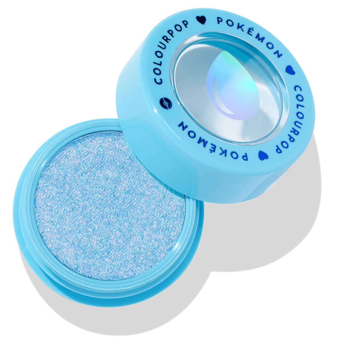 Open ColourPop Super Shock Shadow Hydro Pump shows a shimmering icy blue cream eyeshadow in an aqua round pot, with a matching cap printed COLOURPOP x POKÉMON and a holographic water droplet icon, set on a white background.