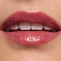 Glossy pink lips wearing ColourPop Ultra Glossy Lip, shade Short Lord, delivering a sheer rosy tint with mirror-like shine; close-up beauty swatch on smooth skin highlights the plush texture and reflective finish.