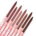 Eight pink-barrel lip liners labeled SO JUICY arranged diagonally, tips exposed to show nude mauve-to-brown shades on a white flat lay; Juiciest Pout, the ColourPop So Juicy Plumping Lip Liner Set.
