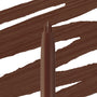 ColourPop So Juicy Plumping Lip Liner with Peptides in Mocha Latte stands upright with its pointed tip exposed as smooth, opaque mocha-brown swatches sweep across a white background, showcasing the creamy, plumping lip pencil shade.