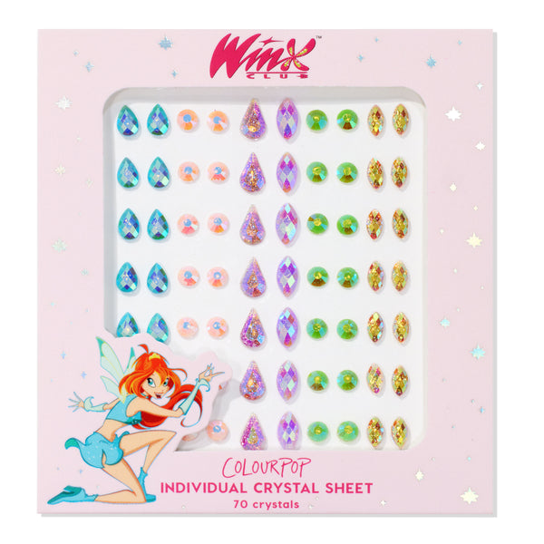 ColourPop Crystal Face Jewels - Individual crystal sheet displaying 70 adhesive gems in teardrop, round, diamond, and marquise shapes in iridescent teal, pink, lilac glitter, and neon green, arranged in rows inside pink Winx Club packaging.