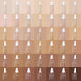 ColourPop Hyaluronic Hydrating Foundation bottle, shade Fair 15 W (warm), stands with white pump and Pretty Fresh label, shown in a grid of shades from light to deep, spotlighting the fair warm tone for US shoppers.