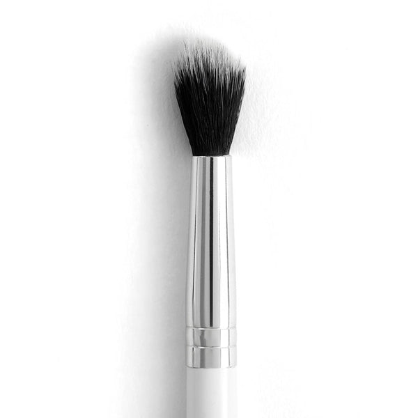 ColourPop Tapered Blending Brush makeup brush diffusing eyeshadow with soft, tapered black synthetic bristles; sleek silver ferrule and white handle shown close up on a white background, ideal for crease work and seamless blending.