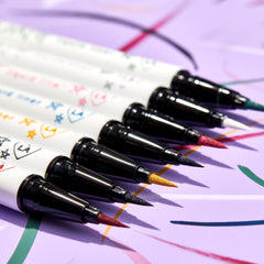 ColourPop BFF Liquid Liner in Crzy, a precision feltβtip eyeliner, creating a crisp swipe; angled lineup of vibrant colored tips beside it on a lavender background with playful swatch lines.