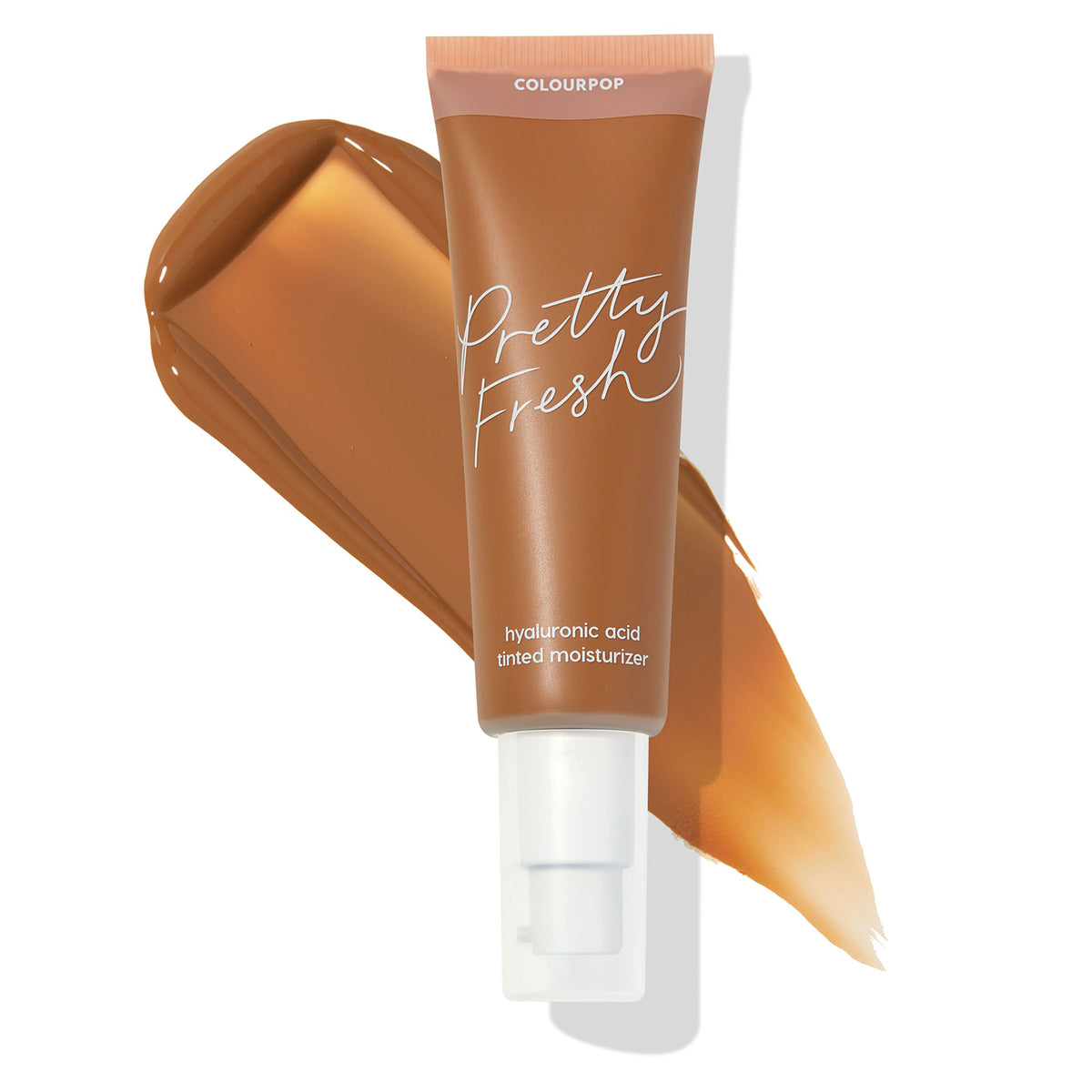 ColourPop Pretty Fresh Tinted Moisturizer in Dark 20 N, tan squeeze tube with white pump and blush cap reading Pretty Fresh and hyaluronic acid, shown over deep neutral swatches on a white background, highlighting lightweight dewy coverage.