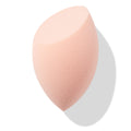 Peach teardrop Blending Sponge with a flat slanted edge resting at an angle, showing fine foam texture for seamless foundation and concealer blending, isolated on white with soft shadow; a must-have in ColourPop Makeup Tools & Accessories.