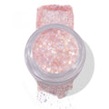 Moonlight Legend ColourPop Glitter Gel in an open clear jar, showcasing an iridescent pastel pink‑lavender formula with fine and chunky holographic sparkles, swatched in a square and softly spilled below on a white background.