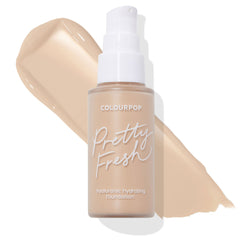 Frosted glass bottle with white pump labeled Pretty Fresh displays ColourPop Hyaluronic Hydrating Foundation, shade Light 45 W, set against a large warm‑beige swatch on a white backdrop, highlighting the light warm undertone.