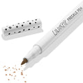 ColourPop Freckle Pen in Soft Brown uncapped, felt-tip applying scattered soft brown freckle dots, with polka-dot white cap beside it on a clean white background; long-wearing, buildable faux freckles makeup.