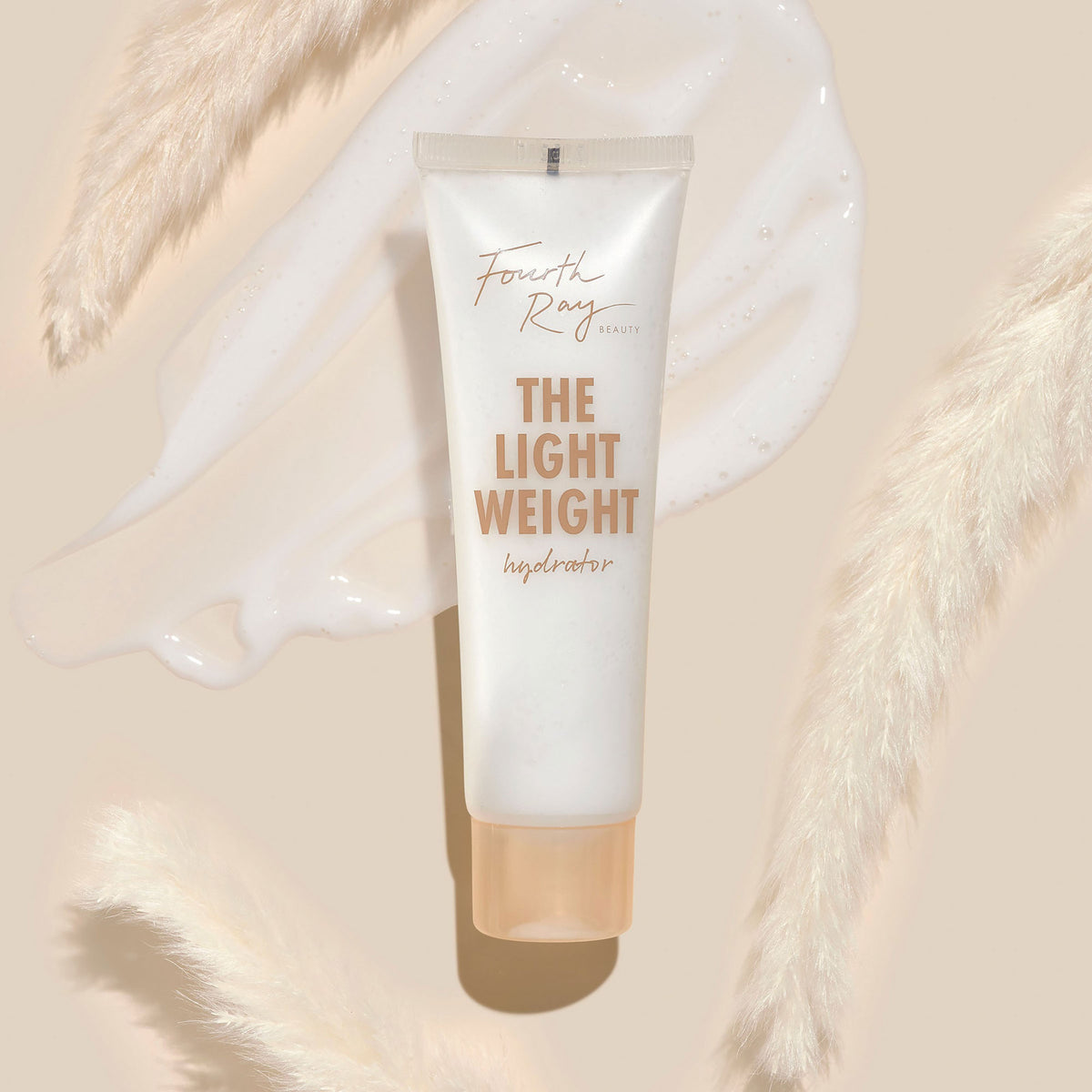 Fourth Ray Beauty The Lightweight hydrator tube showcasing copper lettering, resting over a milky cream swatch on a beige backdrop with pampas grass; ultra-light ColourPop Face Moisturizer in a frosted white tube with a peach cap.