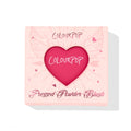 ColourPop Pressed Powder Blush in Text Me showcased in a blush‑pink compact, heart‑shaped window revealing a vibrant fuchsia pan, wing and heart graphics on the box, 4.45 g/0.16 oz, set on a white background.