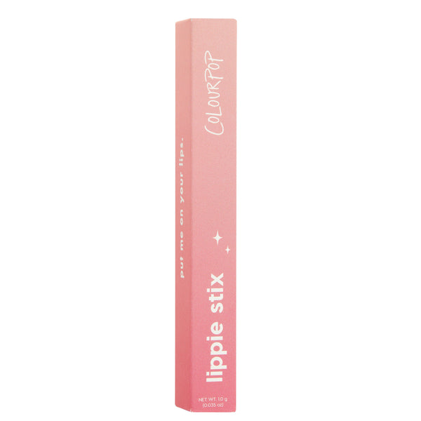 Sassy ColourPop Lippie Stix stands upright in its pink ombrรฉ carton, showing white COLOURPOP and lippie stix text with small sparkle icons and net wt 1.0 g (0.035 oz), set against a clean white studio background.