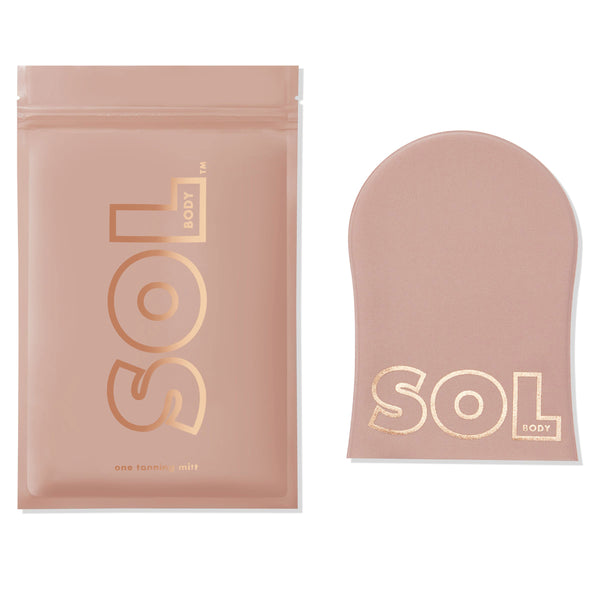 Tanning Mitt showcases a blush-pink, velvety SOL Body applicator lying flat beside its matching resealable pouch on a white background, gold logo visible, for streak-free self-tanner application from ColourPop Makeup Tools & Accessories.