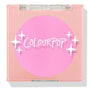 ColourPop Pressed Powder Blush in Flamingo shows a vibrant hot pink pan inside a square peach compact with a clear lid and white sparkles logo, closed and travel-friendly on a light background.