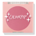 New to U ColourPop Pressed Powder Blush compact, closed - rosy mauve pink pan in a square light pink case with a clear lid printed with white sparkles and the ColourPop logo, studio product shot on white with a soft shadow.