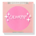 Prairie Air ColourPop Pressed Powder Blush compact sits closed, displaying a vibrant bubblegum pink pan beneath a clear lid with white sparkle icons and the ColourPop logo, housed in a peach square case on a white background.