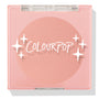 Why Hello ColourPop Pressed Powder Blush compact, closed, displaying a matte peach-pink pan under a clear lid with white ColourPop logo and sparkles, set in a light pink square case on a white studio background.