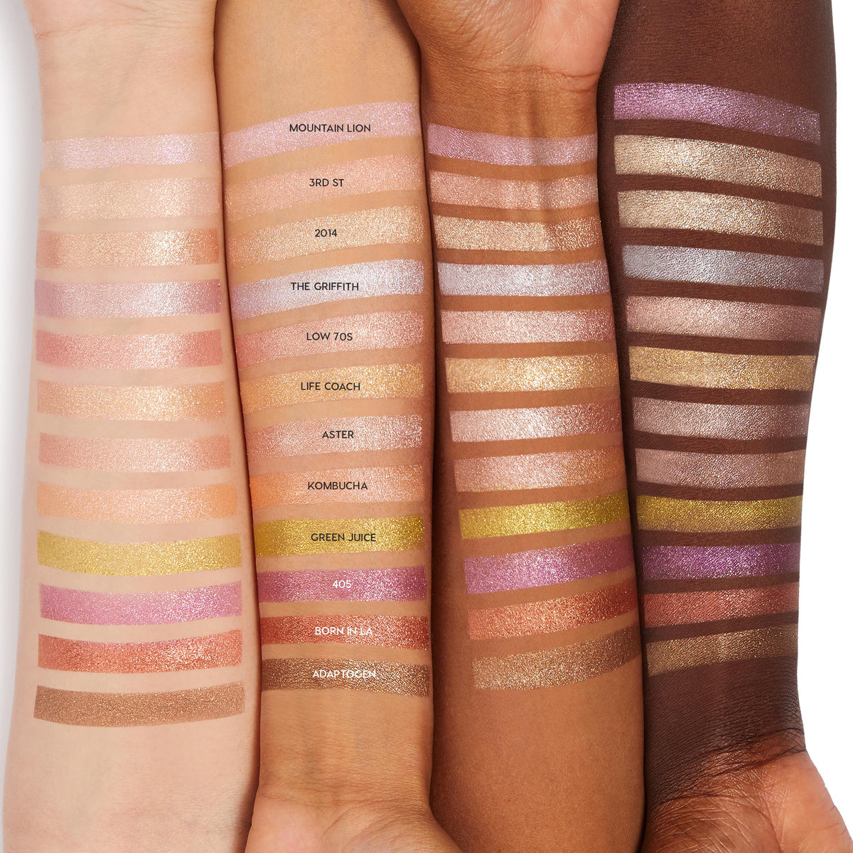Aster ColourPop Super Shock Shadow swatched in one swipe across three forearms, revealing a warm peach-gold shimmer with fine sparkle; neighboring labeled shades show how the luminous finish reads on light, medium, and deep skin tones.