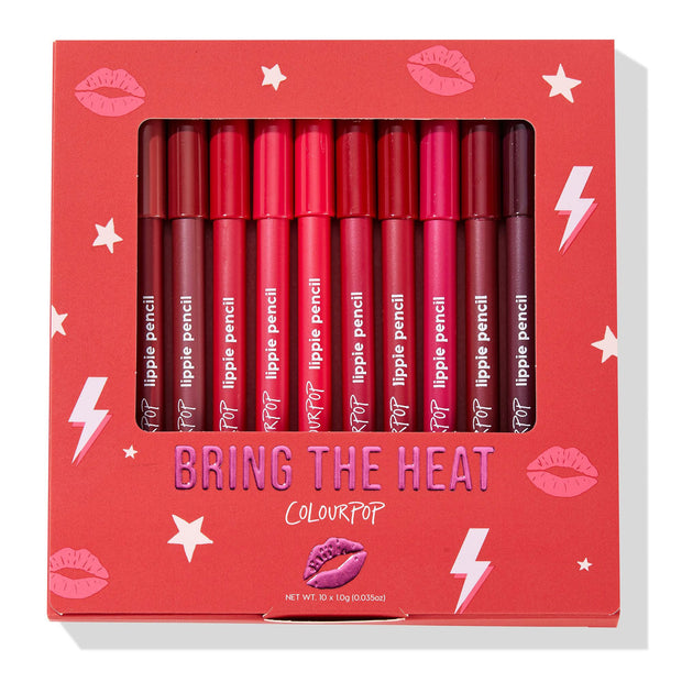 ColourPop Lippie Vault Set Heat Warning displays a 10-piece lippie pencil lineup in a windowed red box, shades from nude rose to fiery reds and deep berry, with lips, stars, and lightning graphics from the Bring the Heat collection.